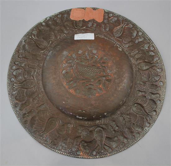 An Arts & Crafts Newlyn circular copper charger, by John Pearson, 15.25in.